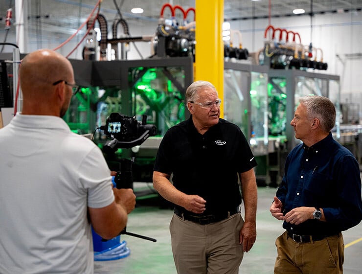 Delkor CEO Dale Andersen walks through the manufacturing campus with NBC News' Tom Costello